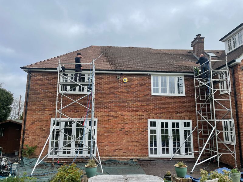 Roof cleaning carried out safely from scaffold towers by The Roof Moss Cleaners in Stratford-upon-Avon